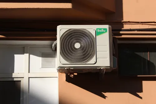 Air conditioning unit mounted outside a home
